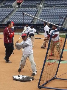 Miles Jackson takes a swing during the L.E.A.D. Celebrity Clinic at Turner Field. 